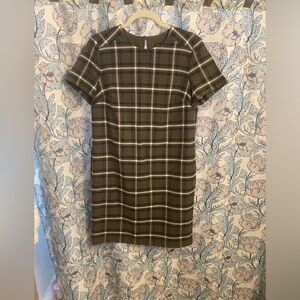 Plaid sheath dress with side pockets.